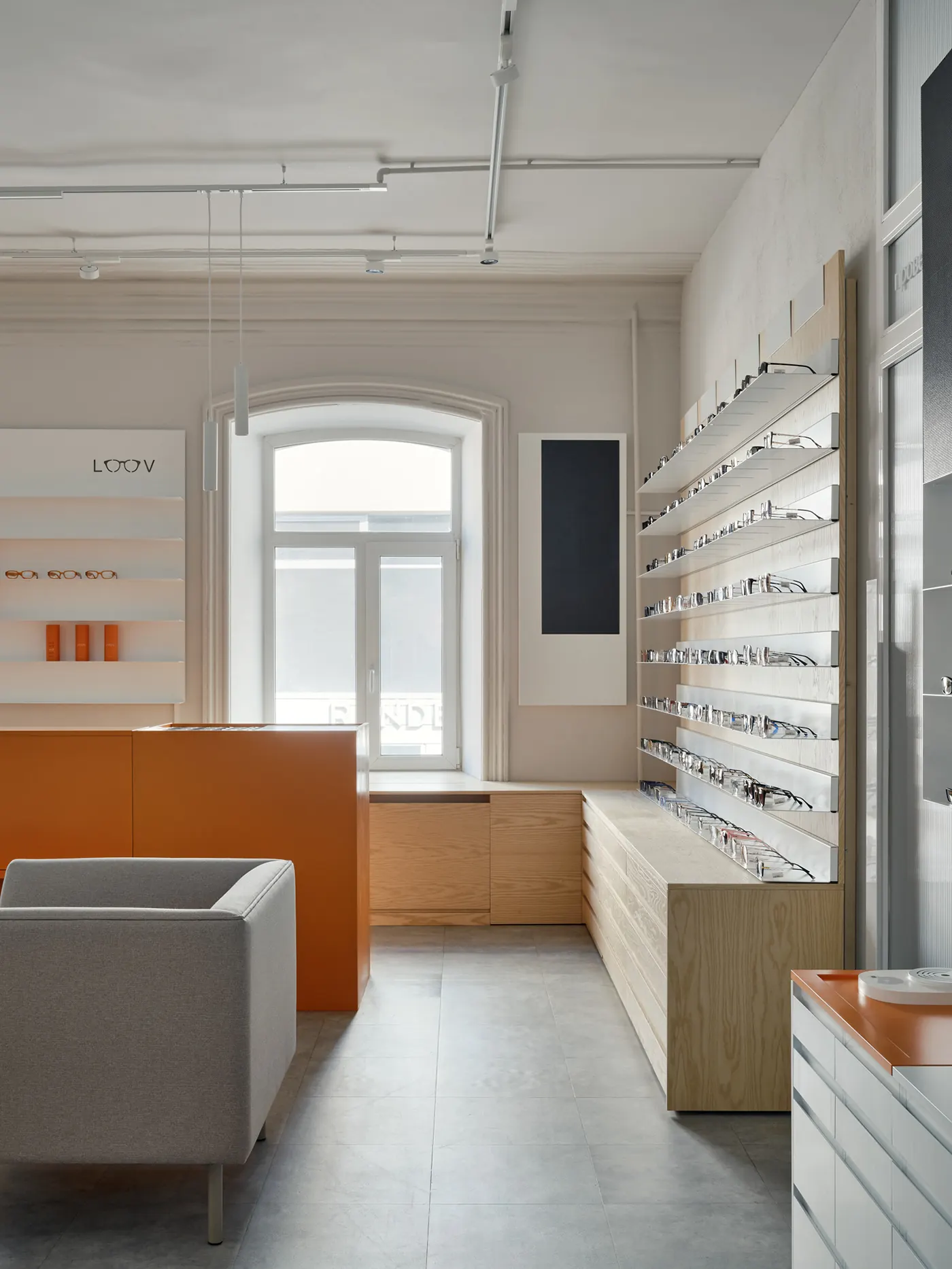 Minimal White Orange Eye Care Center full optical store interior
