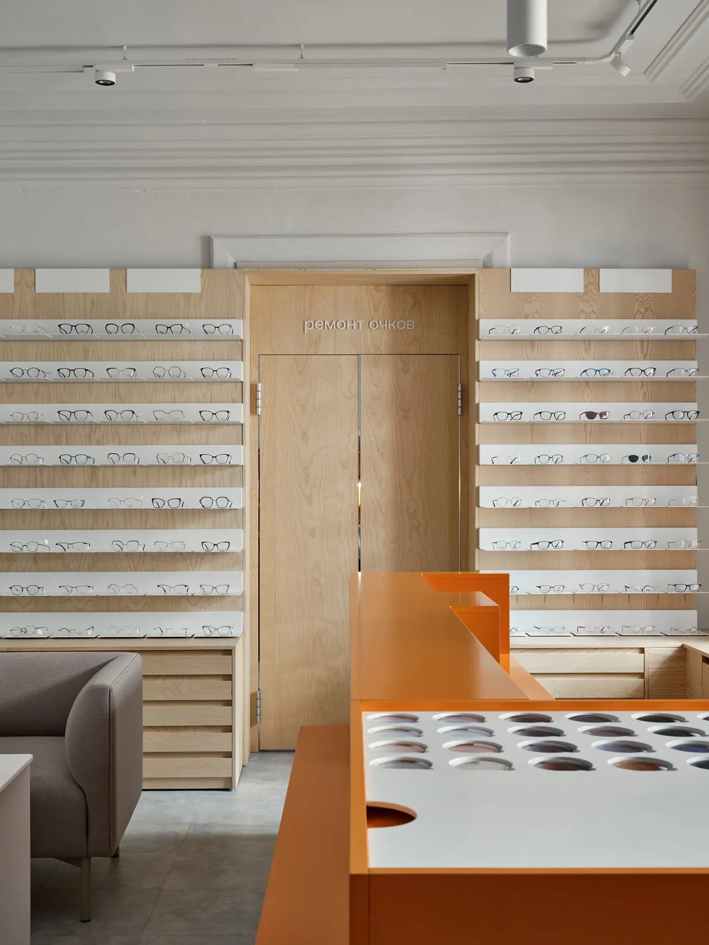 Minimal White Orange Eye Care Center optical shop fixture view