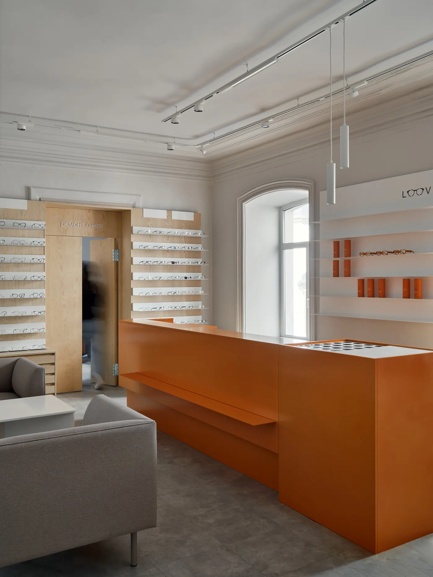 Minimal White Orange Eye Care Center optical shop fixture view